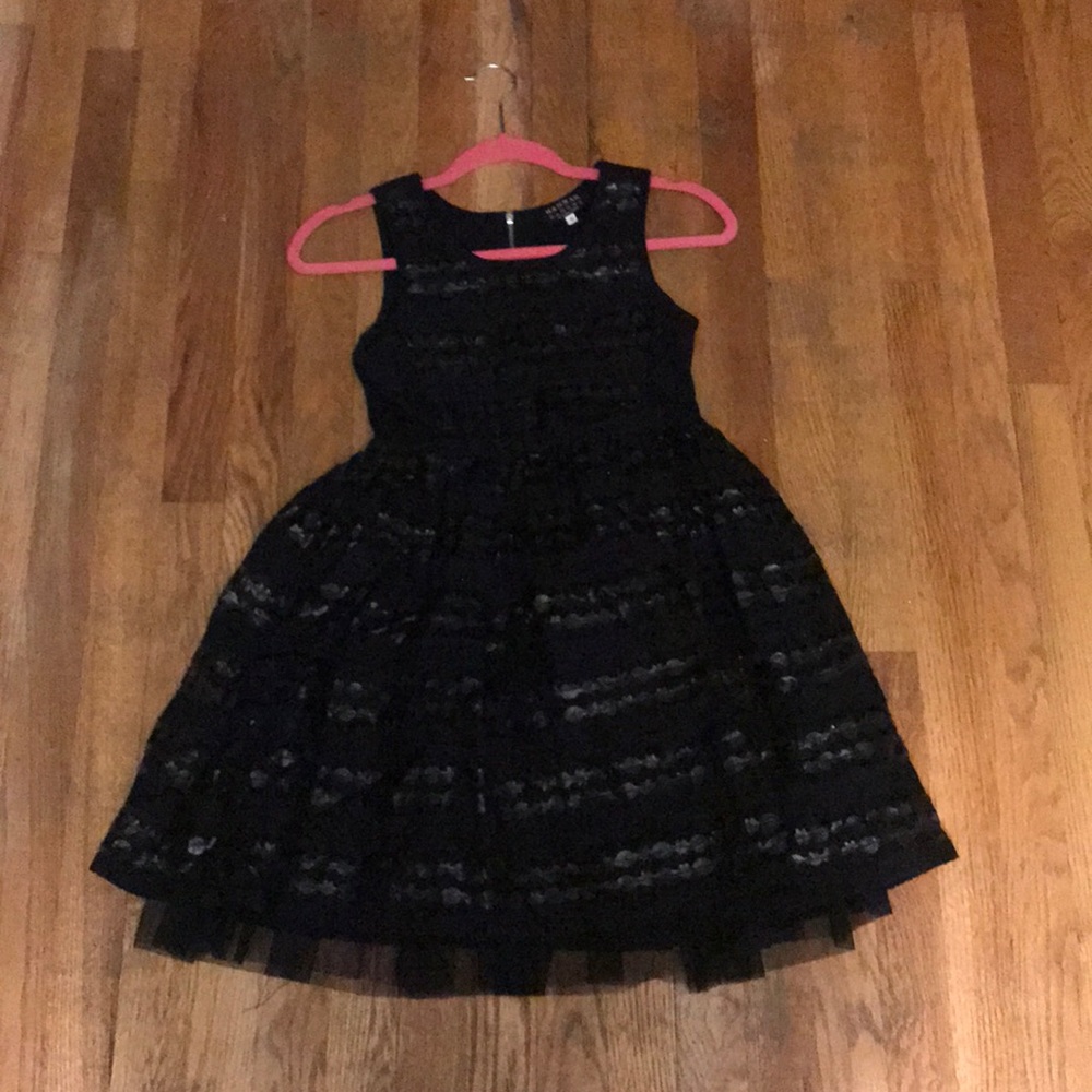 black fluffy dress with ruffles.